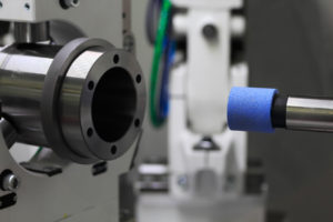 CNC cylindrical grinder with grinding wheel for inside diameter grinding.